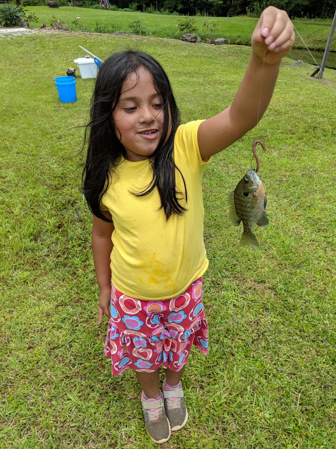 Cub Scout fishing girl
